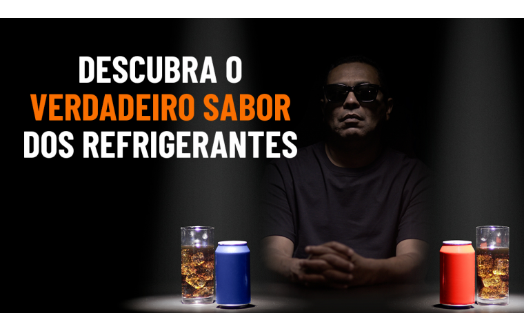 A man wearing sunglasses is sitting in front of two soft drink cans. One is red and the other one is blue. A text reads: "discover the true flavor of soft drinks".