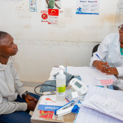 A healthcare worker speaks to a patient