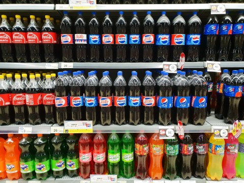 Soft drink bottles on store shelf