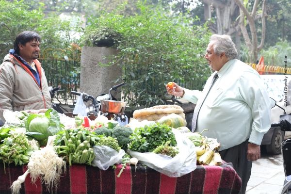 person living with obesity is buying vegetables and fruit