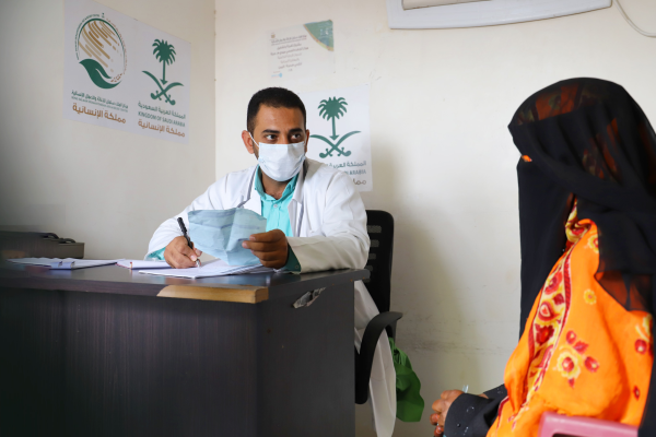 Displaced women and children receive treatment at a charitable health center, amid the exacerbation of the suffering of most Yemeni families