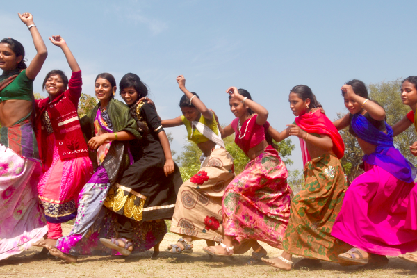 Kishori Club members dance to tribal beats in India. The clubs help girls cope with the physical and emotional challenges of growing up and teaches them to fight for each other