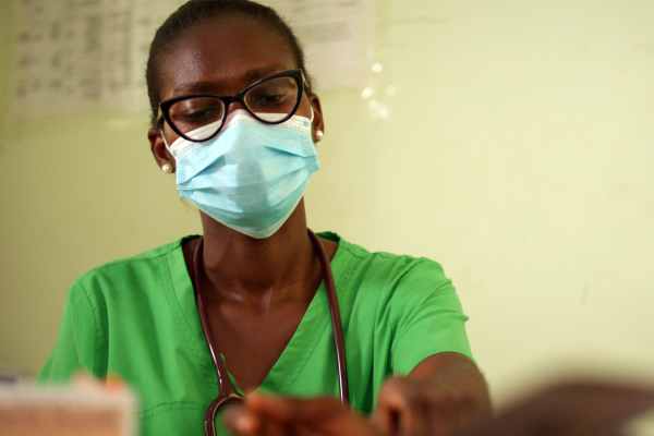 A woman healthworker wearing a mask in Ghana