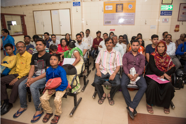 Hospital waiting room full of patients in India